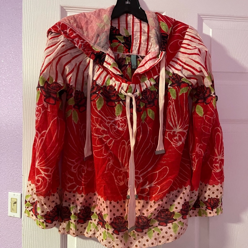 This beautiful hooded top has tags